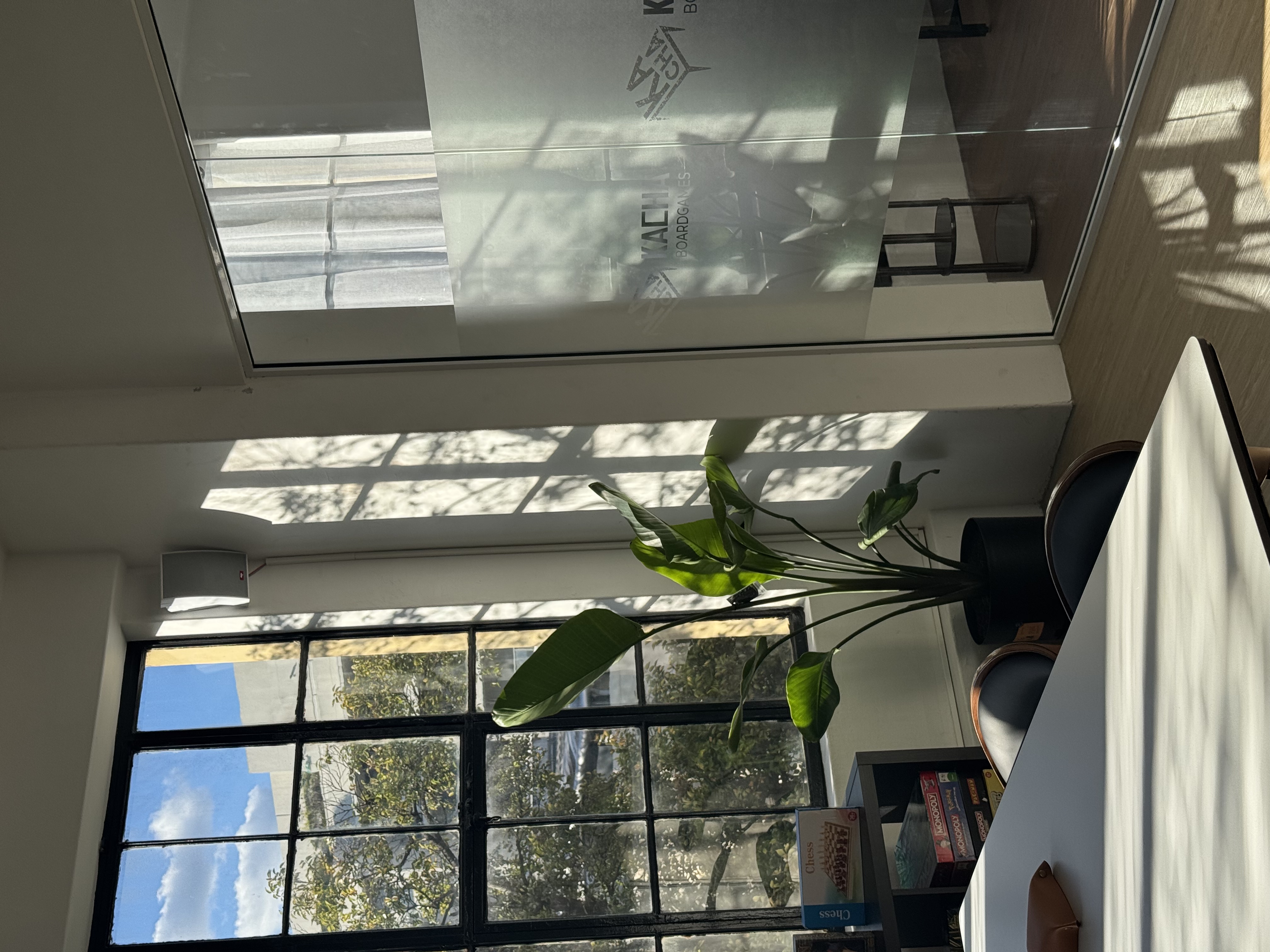 Main Floor — open boardgame seating with sunlight